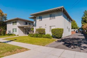 a white house with a driveway at Blueground Old Mountain View pool nr Park SFO-2037 in Mountain View