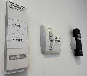 a nintendo wii controller and a computer mouse on a wall at Stunning Studio2, Banstead with free off st parking in Banstead +12 photos