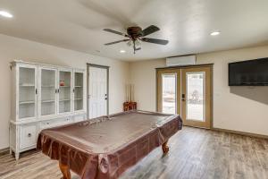 ein Schlafzimmer mit einem Bett und einem Deckenventilator in der Unterkunft Backyard Oasis with Hot Tub and Views Weaverville Gem in Weaverville