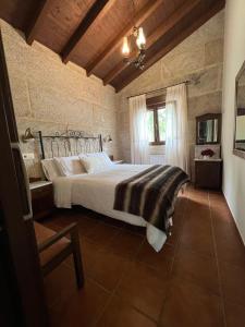 a bedroom with a large bed in a room at Vilaboa Paradise in Villanueva