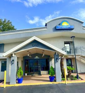 a rendering of the front of a drury inn at Days Inn by Wyndham Tallahassee University Center in Tallahassee