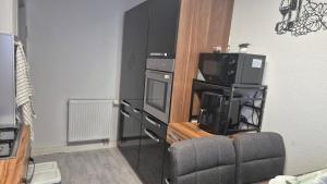 a living room with a couch and a tv and a televisionictericterictericter at FeWo Festungsblick Würzburg in Würzburg +4 photos