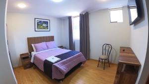 Katil atau katil-katil dalam bilik di Hotel Rosa Mistika Inn