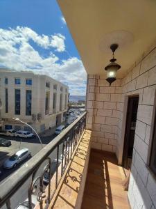 a balcony of a building with a view of a street at فندق برستيج العقبه Prestig in Aqaba