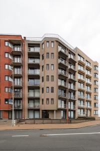 an apartment building on the side of a street at Lets Go Raversijde in Ostend