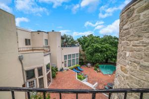 anterior view of a apartment building with a pool at The Hills Quiet Spacious Gated Community with Pool! in The Hills