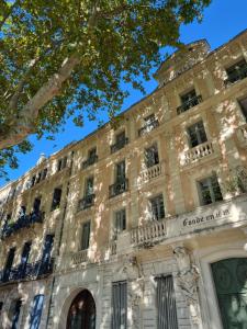 a large building with a sign on it at La Bulle Carrée - Centre Historique médiéval - in Lapalme