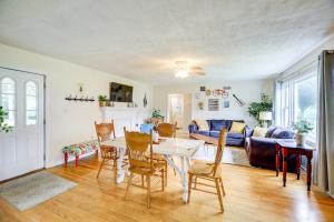 a living room with a table and chairs at Cozy Home with Spacious Yard 2 Mi to Dtwn Bristol in Bristol