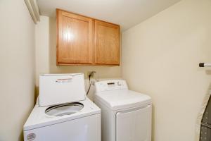 a small laundry room with a washer and dryer at Cozy Home with Spacious Yard 2 Mi to Dtwn Bristol in Bristol