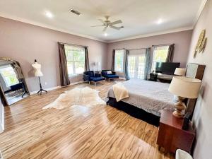 a bedroom with a bed and a desk and a couch at Luxury Event and Stay in Celina, Texas in Gunter