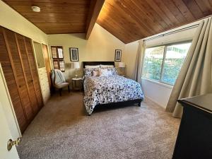 a bedroom with a bed and a window at Medford Home And 2 Condos With Pool in Medford +73 photos