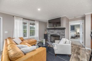 a living room with a couch and a fireplace at Private Retreat by the Ecusta Trail and Downtown in Horse Shoe