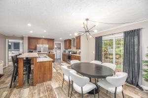 a kitchen and dining room with a table and chairs at Private Retreat by the Ecusta Trail and Downtown in Horse Shoe