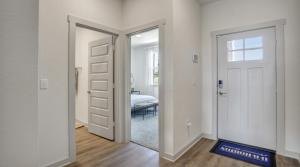 a hallway with an open door and a bedroom at Peaceful Room in Austin in Austin