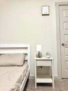 a bedroom with a bed and a table with a lamp at Peaceful Room in Austin in Austin