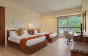 Voodi või voodid majutusasutuse Pico Sands Hotel toas