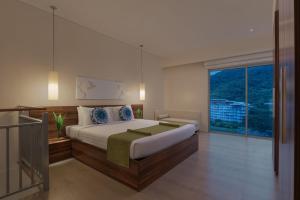Voodi või voodid majutusasutuse Pico Sands Hotel toas