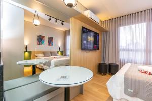 Postel nebo postele na pokoji v ubytování Studio Super Completo em Região Tranquila -EIX0202