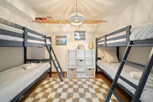 a bedroom with two bunk beds at Hill Station in Beech Mountain