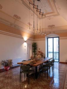 a dining room with a long table and chairs at Casale della Vittoria in Taranto