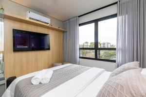 Postel nebo postele na pokoji v ubytování Studio Super Completo em Região Tranquila -EIX0402