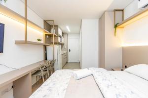 Postel nebo postele na pokoji v ubytování Studio Ensolarado em Região Tranquila - EIX0407