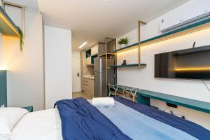 Postel nebo postele na pokoji v ubytování Studio Completo em Região Tranquila - EIX0502