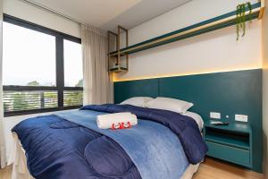 Postel nebo postele na pokoji v ubytování Studio Completo em Região Tranquila - EIX0502