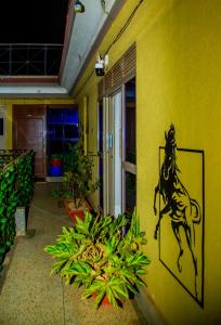 a painting of a horse on the side of a building at Blaize Affaire Apartments in Kampala