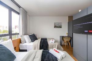 En eller flere senge i et værelse på Studio com 2 camas de casal e garagem - EIX0805 + 72 billeder