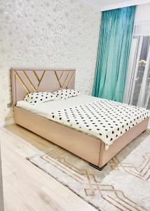 Postel nebo postele na pokoji v ubytování 2-комнатная квартира Жана кала