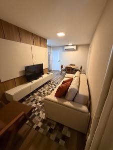 Et tv og/eller underholdning på Apartamento Premium Lazer Completo, Rooftop e Academia