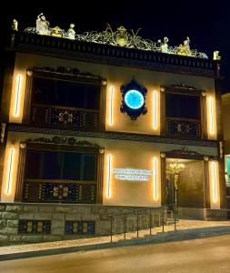 a building with a clock on the front of it at Prime Suites Hotel in Yerevan