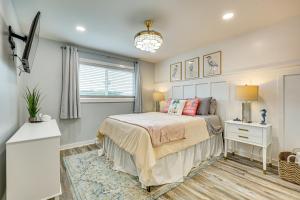 a bedroom with a bed and a window at Poolside Fun + Oceanfront Bliss: Kure Beach Haven! in Kure Beach +21 photos