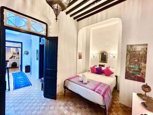 a bedroom with a bed in a room at Tangier Heritage Riad - Bay Views & Kasbah in Tangier