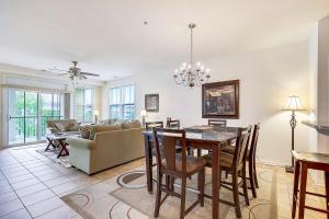 a dining room and living room with a table and chairs at Sunset Island - 35 Fountain 3E in Ocean City