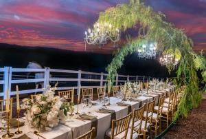 a table set up for a wedding with a chandelier at Villa on 5 Acre Vineyard Equestrian Estate, Pool & Hot tub, Events in Murrieta +97 photos