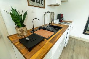 a kitchen with a sink and a counter top at 10 Minutes from Universal - Relaxing Guest Suite in Orlando