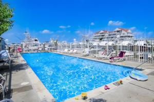 a swimming pool with a cruise ship in the background at White Marlin 307B in Ocean City