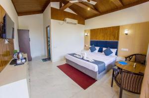 Postel nebo postele na pokoji v ubytování Corbett Jungle Breeze + 16 fotografií