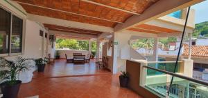 an open hallway of a house with a balcony at Hotel y Bungalows Resort in Los Ayala