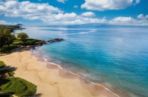 an aerial view of a beach in the ocean at Chic Maui Condo Steps From Beach & Ocean in Wailea