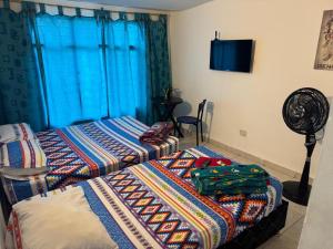 Giường trong phòng chung tại Casa Olimpico