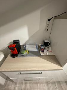 a small kitchen with a counter top in a room at Lovely apartment near the beach in Follonica