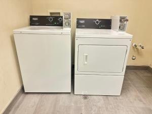 two refrigerators sitting next to each other in a room at Country Inn & Suites by Radisson, Concord (Kannapolis), NC in Concord +36 photos
