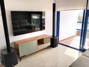 a living room with a couch and a large mirror at Dream apartment in Isla Plana in Mazarrón