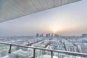 a view of the city from the top of a skyscraper at Cozy 1BR Apartment Nr World Trade Centre BurJuman in Dubai