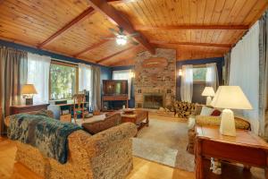 a living room with a couch and a fireplace at Lakefront Escape: Waterfront Lake Champlain Home in North Hero