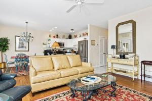 a living room with a couch and a table at Ocean Club I-202 in Indian Beach