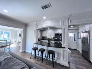 a kitchen and living room with a couch and a table at Destination #01 in Anaheim